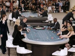 people palying poker in the middle of a runaway show 