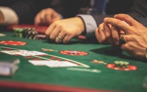 men being around a casino table 