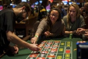 college students playing a casino game