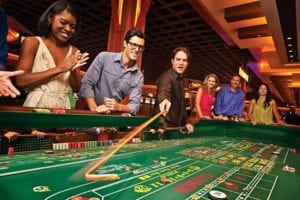 people playing a casino game gambling